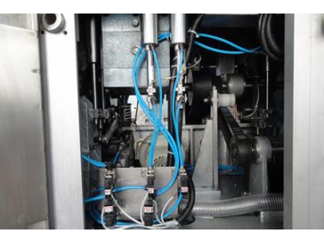 Máquina de cargado y sellado de pasta dental